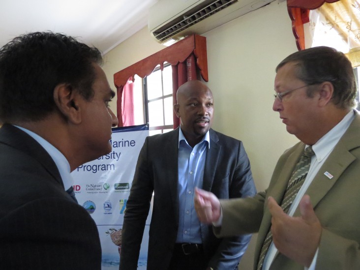 Mission Director , Christopher Cushing, right , engages Sabota Caesar and USAID;s Environmental Specialist , Joth Singh.
