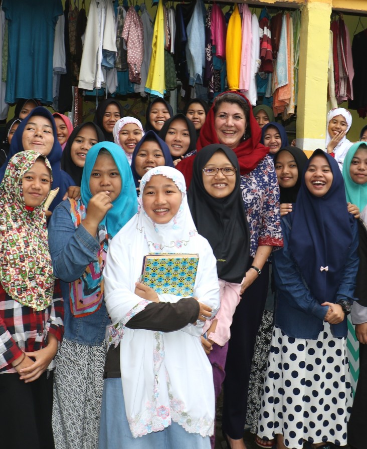 USAID Mission Director Erin McKee poses with Dorm D residents