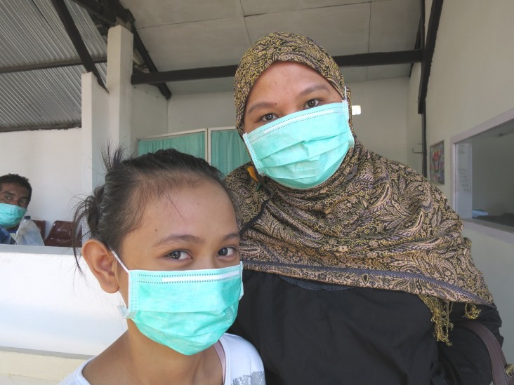A young girl with multidrug-resistant TB, just beginning treatment, with her mother in Makassar