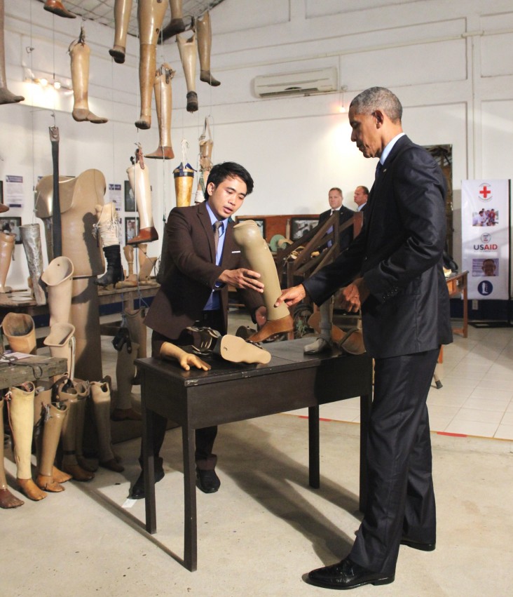 President Barack Obama visits the USAID-supported Cooperative Orthotic and Prosthetic Enterprise.
