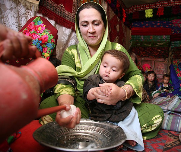 In Afghanistan, mothers are trained in improved hygiene practices as part of USAID's MCHIP project.