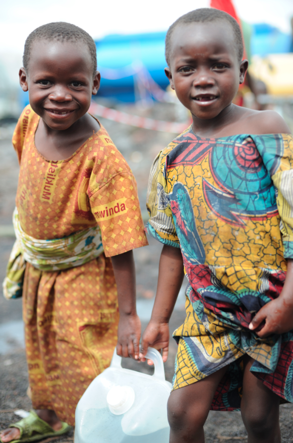 Girls work together in the Kibati refugee camp in the Democratic Republic of Congo