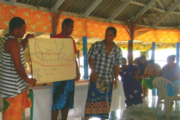 Manase villagers drew maps on large sheets of paper to analyze the layout of their community’s assets.