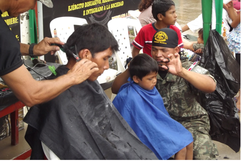 Peruvian Army commandos provide haircuts during the caravan held in held in Padre Abad province, March 23-24, 2013.