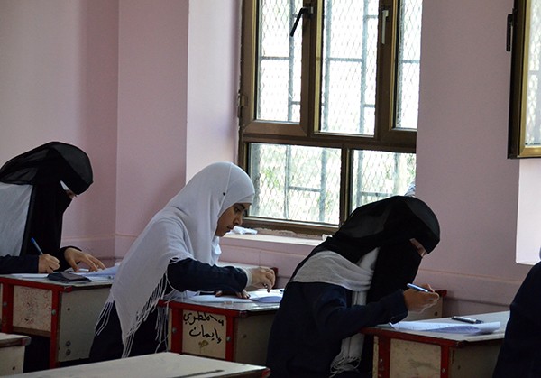 Girls at a newly refurbished school in Yemen take their exams.
