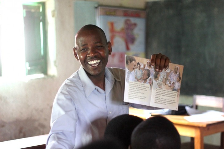 Celestin Ntirushwa, a teacher mentor, works with teachers on how to use new storybooks in their classrooms.