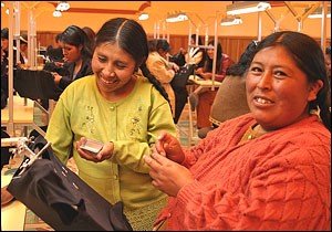 Embroiderers from a small business in Bolivia work to meet their export orders. 