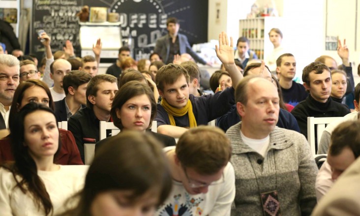 The audience poses questions to the teams as they present their prototypes at a hackathon in Ukraine in February 2015.
