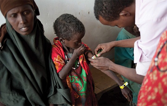 A Somali boy is checked for malnutrition at a refugee camp in Kenya. Somalia, which has endured 20 years of conflict, descended 