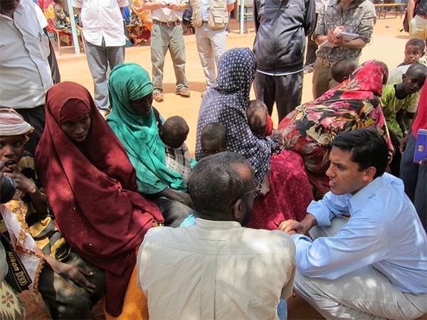 USAID Administrator Rajiv Shah speaks with recently arrived women and children at Dadaab camp in Kenya. 