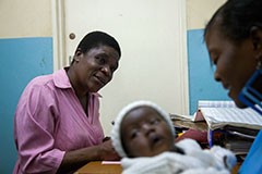Zephinas, a Tingathe community health worker (CHW) in Lilongwe, Malawi, counsels Katie, a young, HIV-positive mother