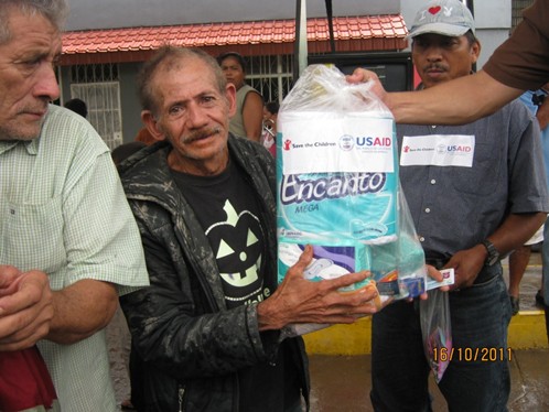 USAID/OFDA distributes emergency relief supplies following flooding and landslides in El Salvador in October 2011.  