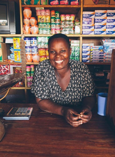 Maama Tina’s income from her shop in Uganda doubled after a USAID loan guarantee helped make Bugala Island’s development attract