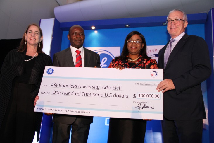  USADF’s Shari Berenbach (left) and GE’s Jay Ireland (far right) presenting the grant to some of the winners from Nigeria