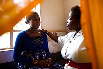 A nurse consults with an expectant mother
