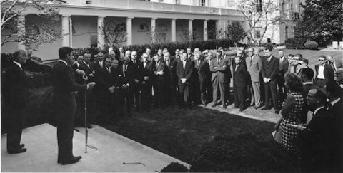 President Kennedy addresses a group of USAID Mission Directors and Deputy Mission Directors in the White House Rose Garden in Wa