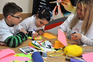 Turkish speaking student from Prizren and their teacher during bookmaking activity