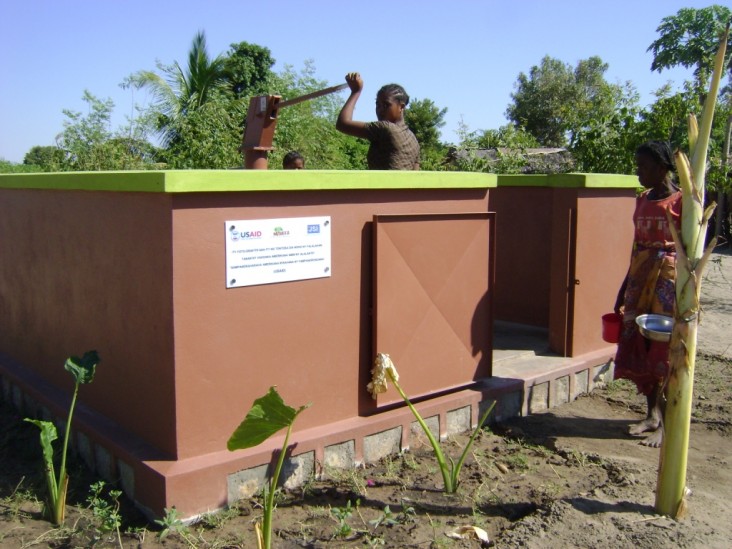 Beneficiary using water tap provided by USAID-funded JSI/Mahefa project