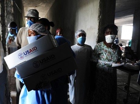 Personnel distribute USAID hygiene kits at a Cholera Treatment Center in Verrettes in the Artibonite department of Haiti.
