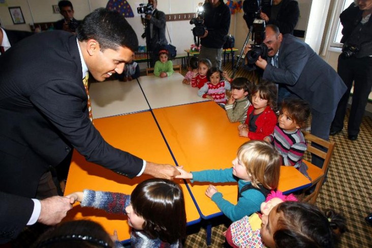 USAID's Raj Shah greets young Syrian children in Turkey. Photo Credit: Adem Altan / AFP