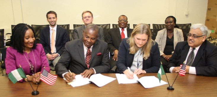 Mr. George Etomi and Power Africa’s Lisa Coppe sign the Memorandum of Cooperation between Eko Electricity Distribution Company a