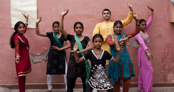 hese youth, in the Perna community, are posing in a traditional bhangra folk dance stance. 