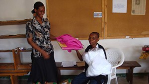 PLHIV at home receive a mosquito net and bed sheet from an HBC provider (PLHIV): Morogoro Municipal.  