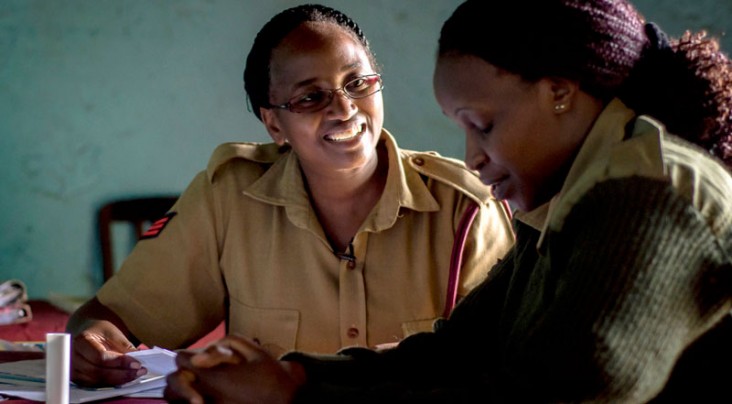 Sgt. Pauline administers an HIV test for a fellow Kenyan Administration Police officer. 