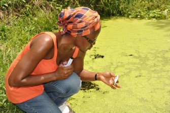 A BETTER TOMORROW: Carolyn Tyhra Kumasi conducts sampling on polluted feeder streams, Kumasi, Ghana.
