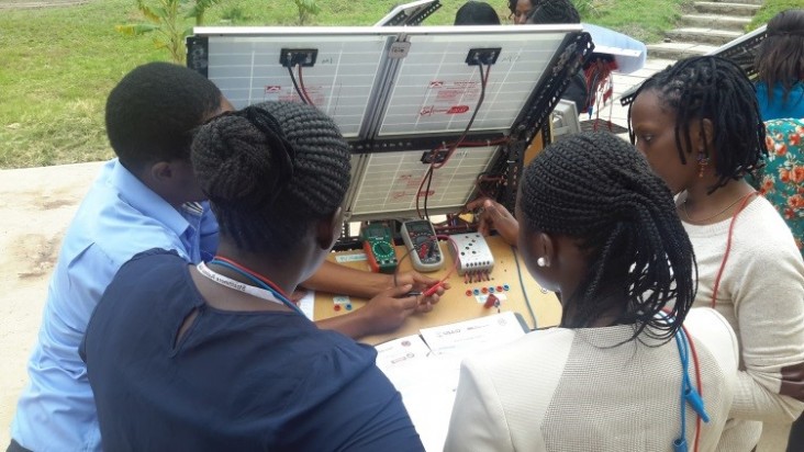 Trainees learning how to troubleshoot PV system components.