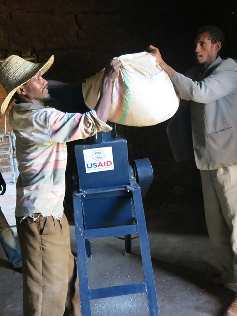 Workers demonstrate how the livestock grinder works. The equipment was provided to Ethio-Feed through a USAID grant.