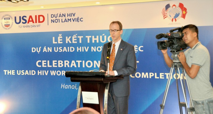 USAID Mission Director Joakim Parker addresses an event for the USAID HIV Workplace Project. 