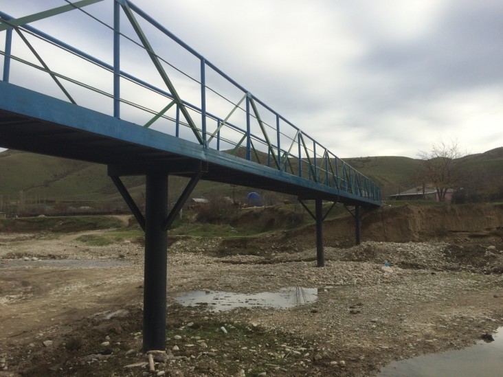 The new bridge will improve daily communication and school attendance for more than 40 families in the Surra community.