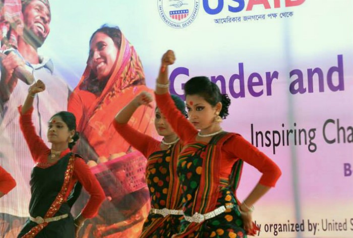 Photo of local girls' dance troupe in Rangpur, Bangladesh performing at gender and development fair.