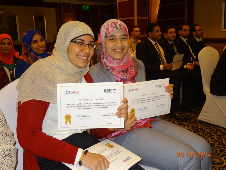 Two of the engineers who interned with EGEC proudly display their certificates of completion.