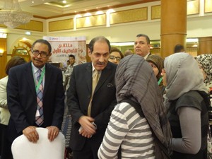 General Al-Harras and Dr. William Patterson visit with Employment Fair participants.