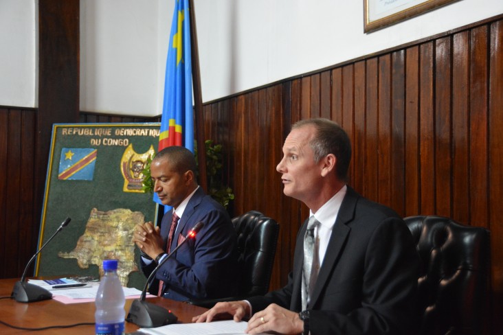 Richard Kimball (right), deputy director of USAID/DRC's Democracy, Human Rights and Governance office, makes opening remarks