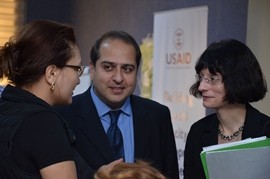 USAID Mission Director converses with a training participant.