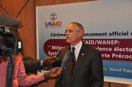 U.S. Chargé d'Affaires Andrew Haviland speaks at the USAID Electoral Violence Early Warning System launch in Abidjan