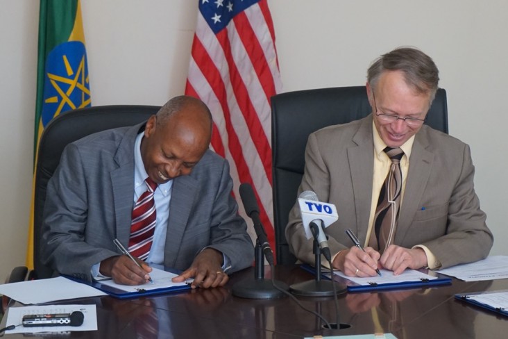 Central Statistical Agency Director General Biratu Yigezu (left) and USAID Ethiopia Mission Director Dennis Weller sign an agree