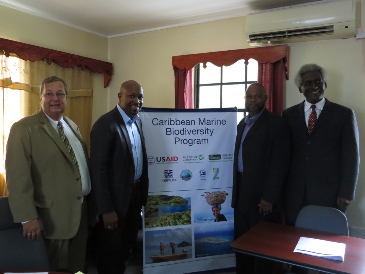  Ambassador Larry Palmer (left) and Mission Director Christopher Cushing (right)  are joined by Saboto Caesar, St. Vincent