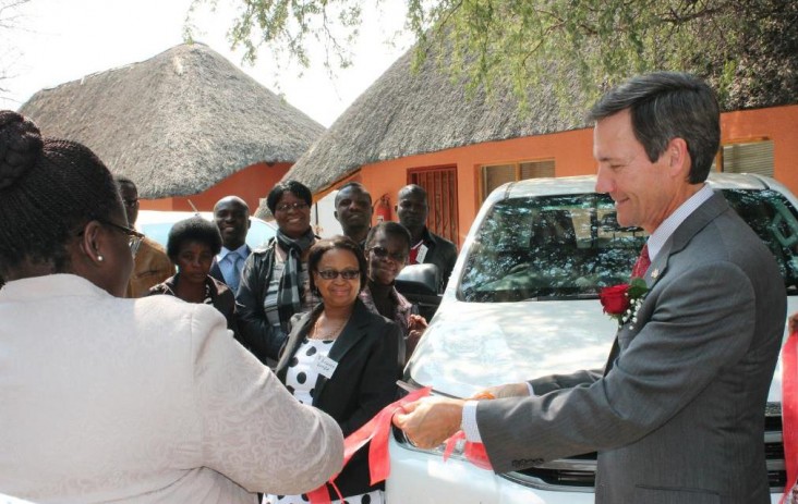 USAID hands over 4 double-cab vehicles to various health districts.