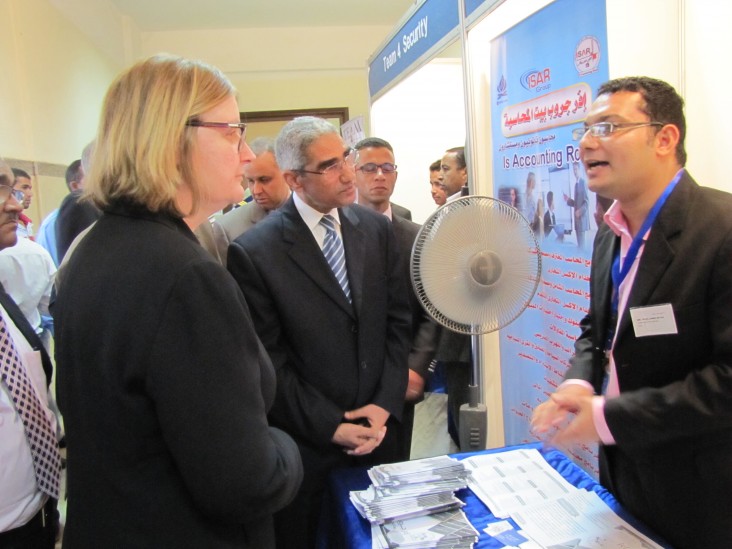 USAID Mission Director Dr. Mary C. Ott engages in discussions with employers as they tour the job fair.