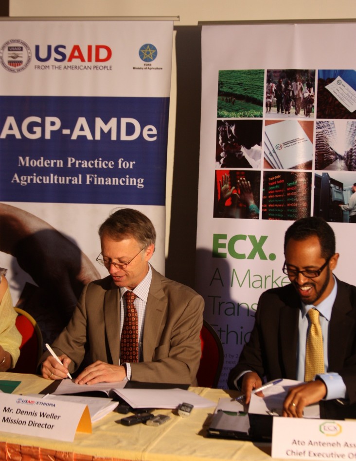 USAID Mission Director Dennis Weller and Ethiopia Commodity Exchange CEO Ateneh Assefa at the signing of a memorandum of underst