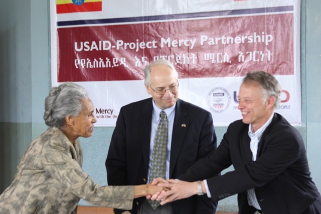 Project Mercy Executive Director Marta Gabre-Tsadick (left) and USAID Ethiopia Mission Director Dennis Weller shake hands