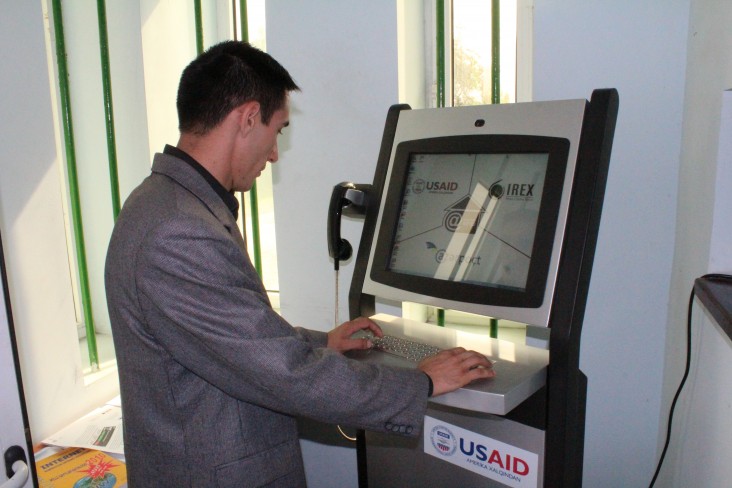 A community member connects to the virtual world through an internet kiosk