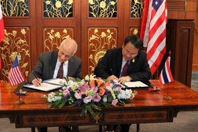 USAID Asia Mission Director Michael Yates and Thailand International Development Cooperation Director-General Piroon Laismit sig