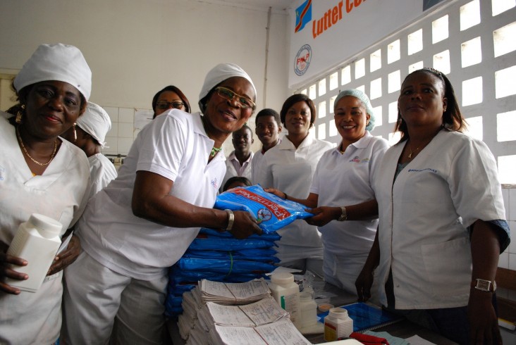 Staff at the Maternal and Child Health Center in Barumbu, Kinshasa, show packages of insecticide-treated bed nets. 