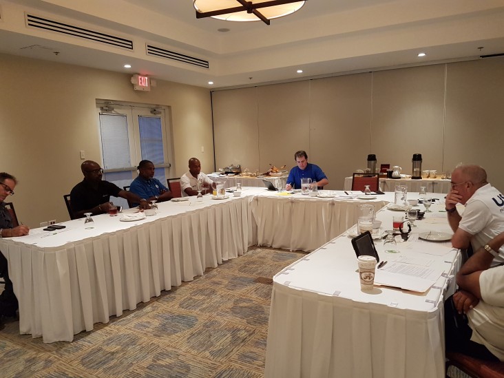 Tim Callahan, meets with members of the Barbados Surge team