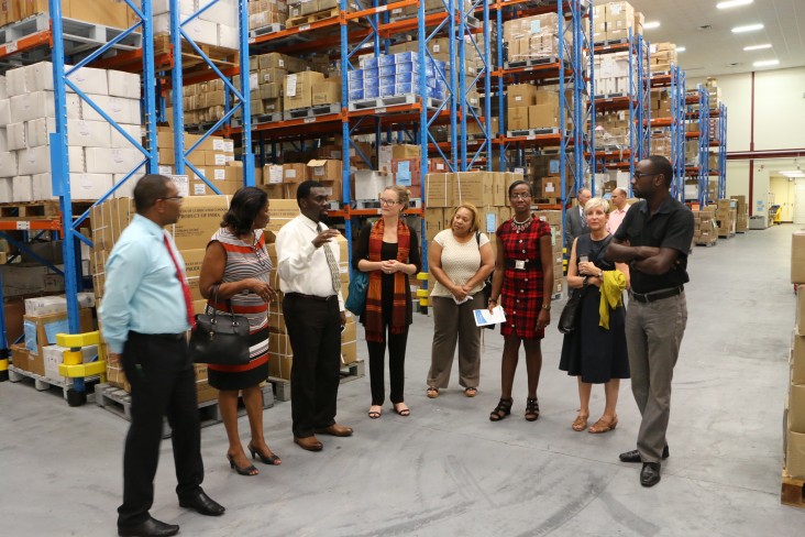 Officials tour the new Supply Chain Management Complex in Guyana during the close out of USAID's Supply Chain Management System 